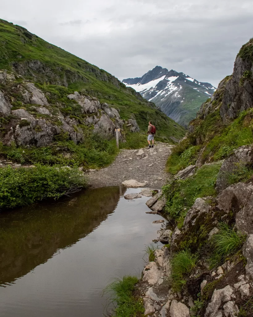 boy at the top of portage pass
