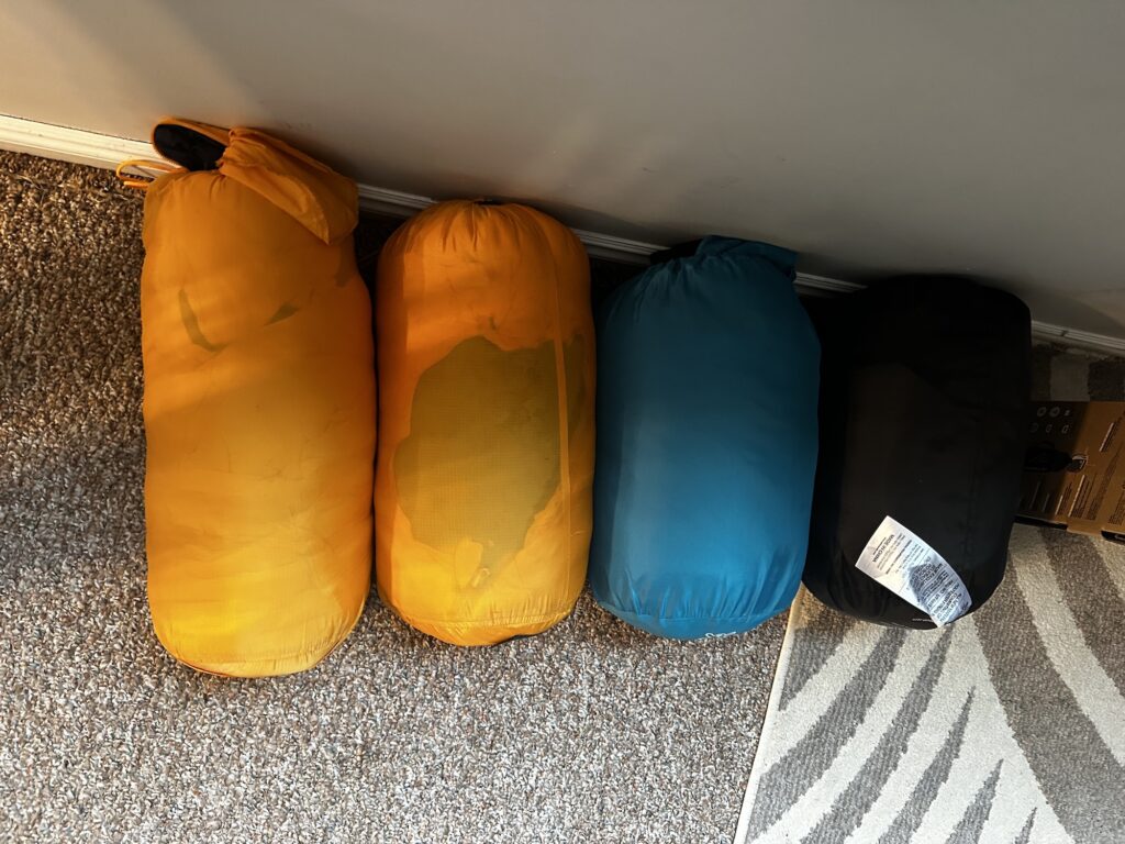 four sleeping bags in a row
