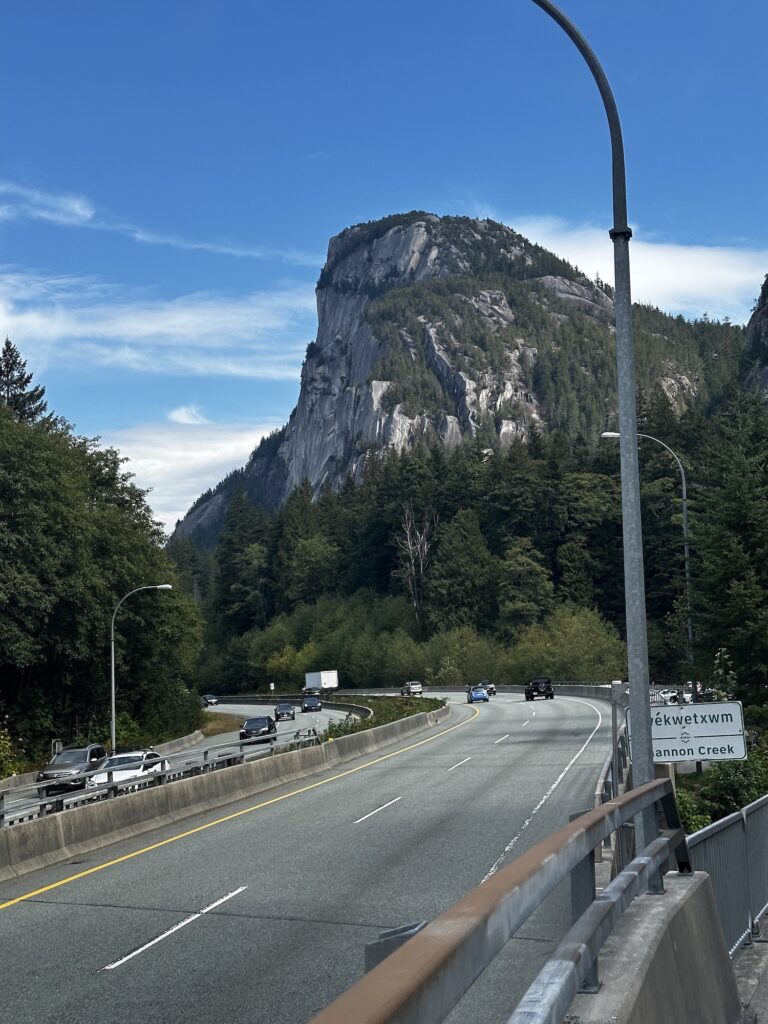 The Chief Mountain above lanes of traffic on sea to sky highway