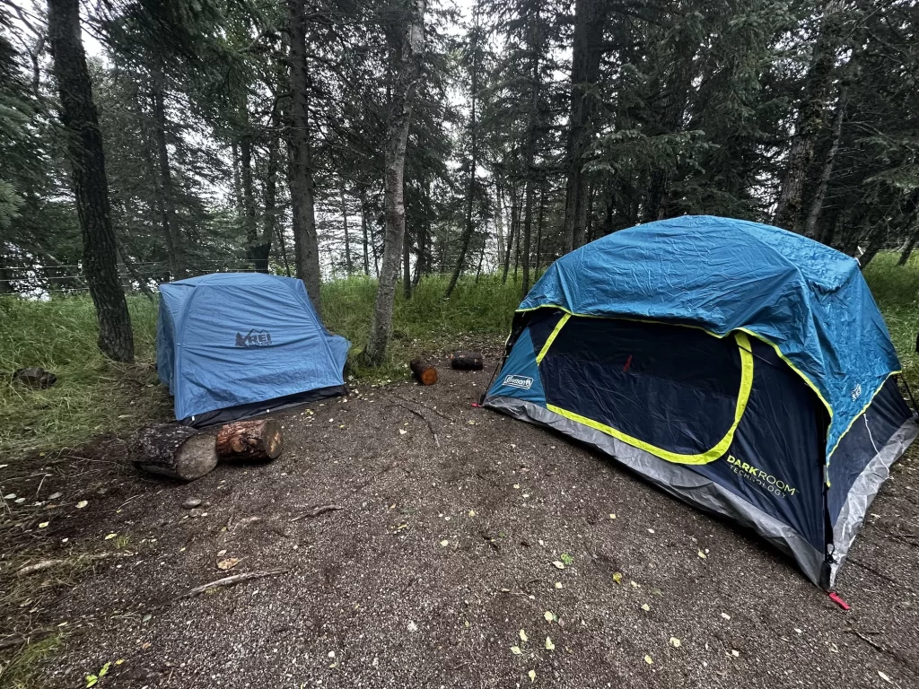 two tents set up in the woods at brook falls