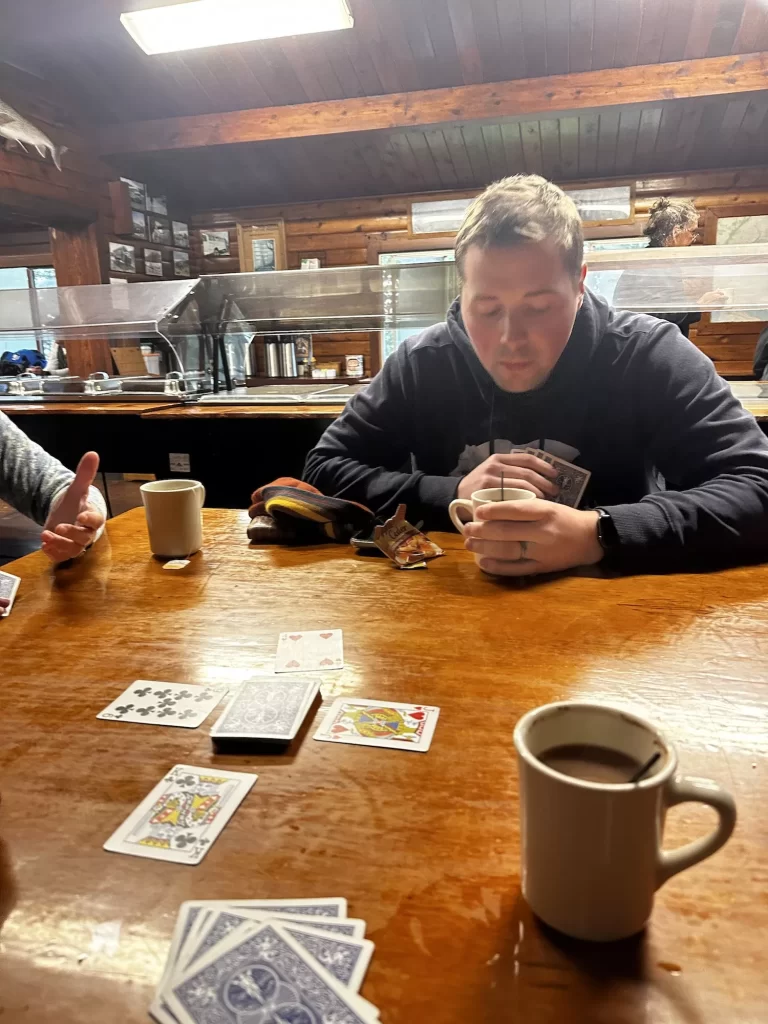 playing cards in a wooden lodge