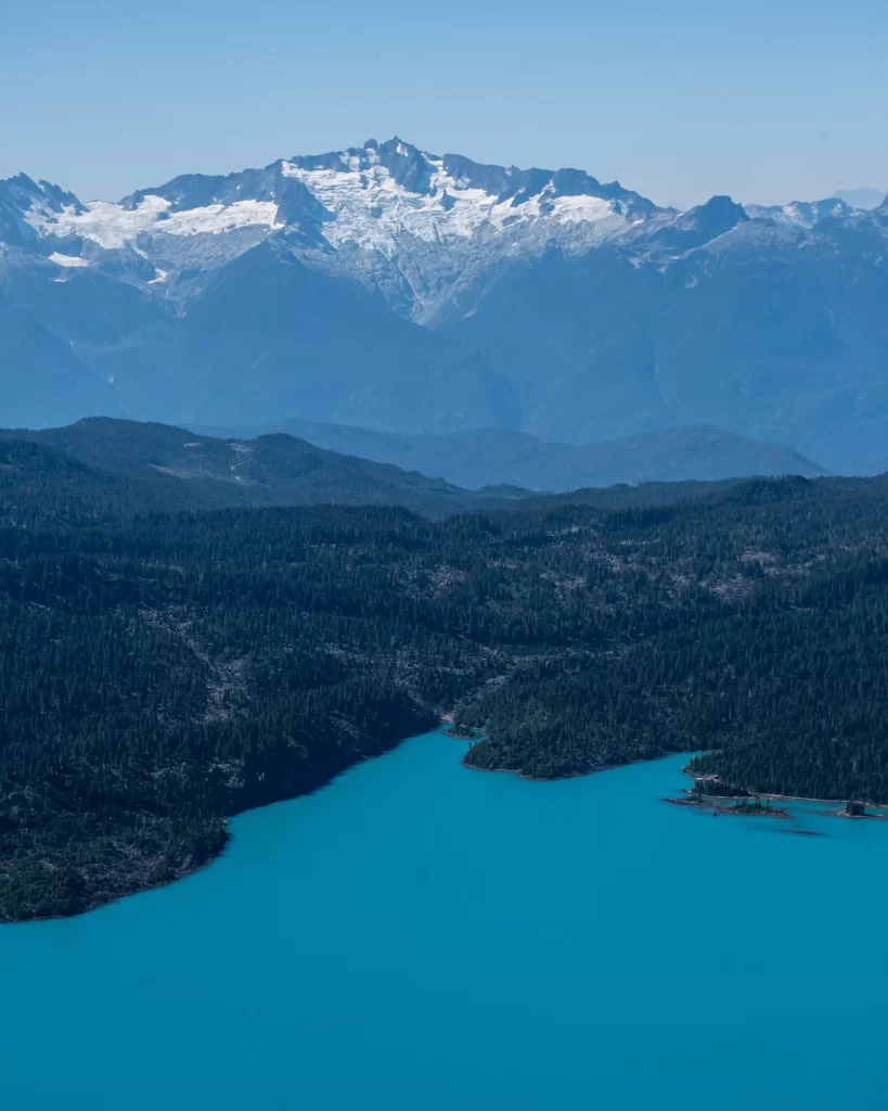 Garibaldi Lake sitting below a mountain peak above