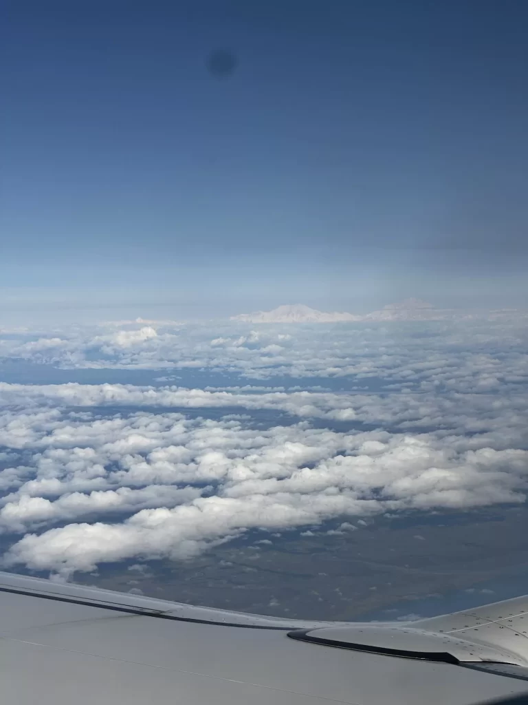 denali popping up above the clouds