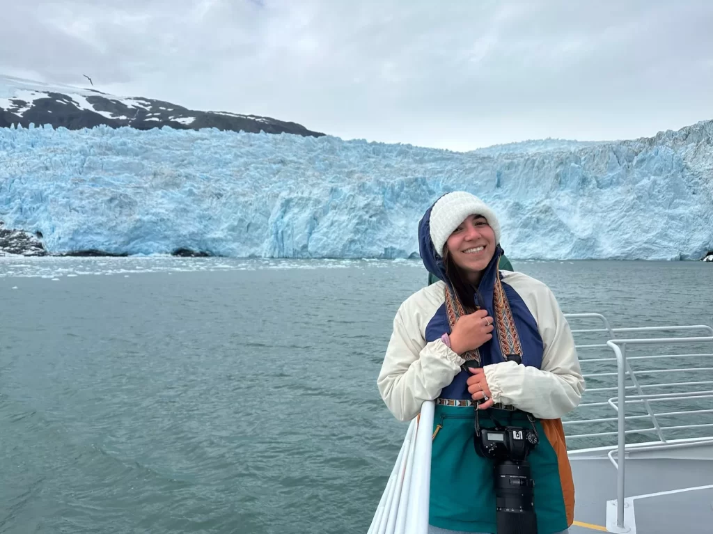 Girl in front of glacier in Alaska