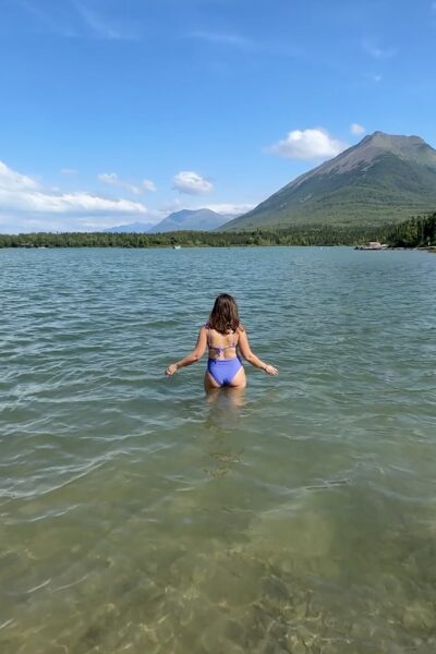 Woman standing in waters of Lake Clark