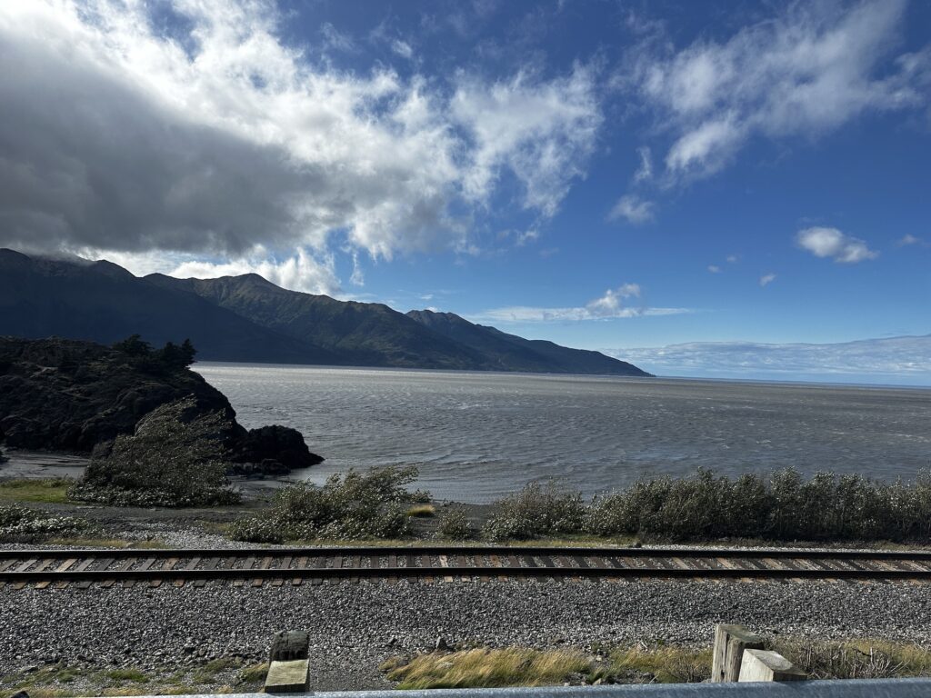 Views from Highway in Alaska with train tracks and water after it
