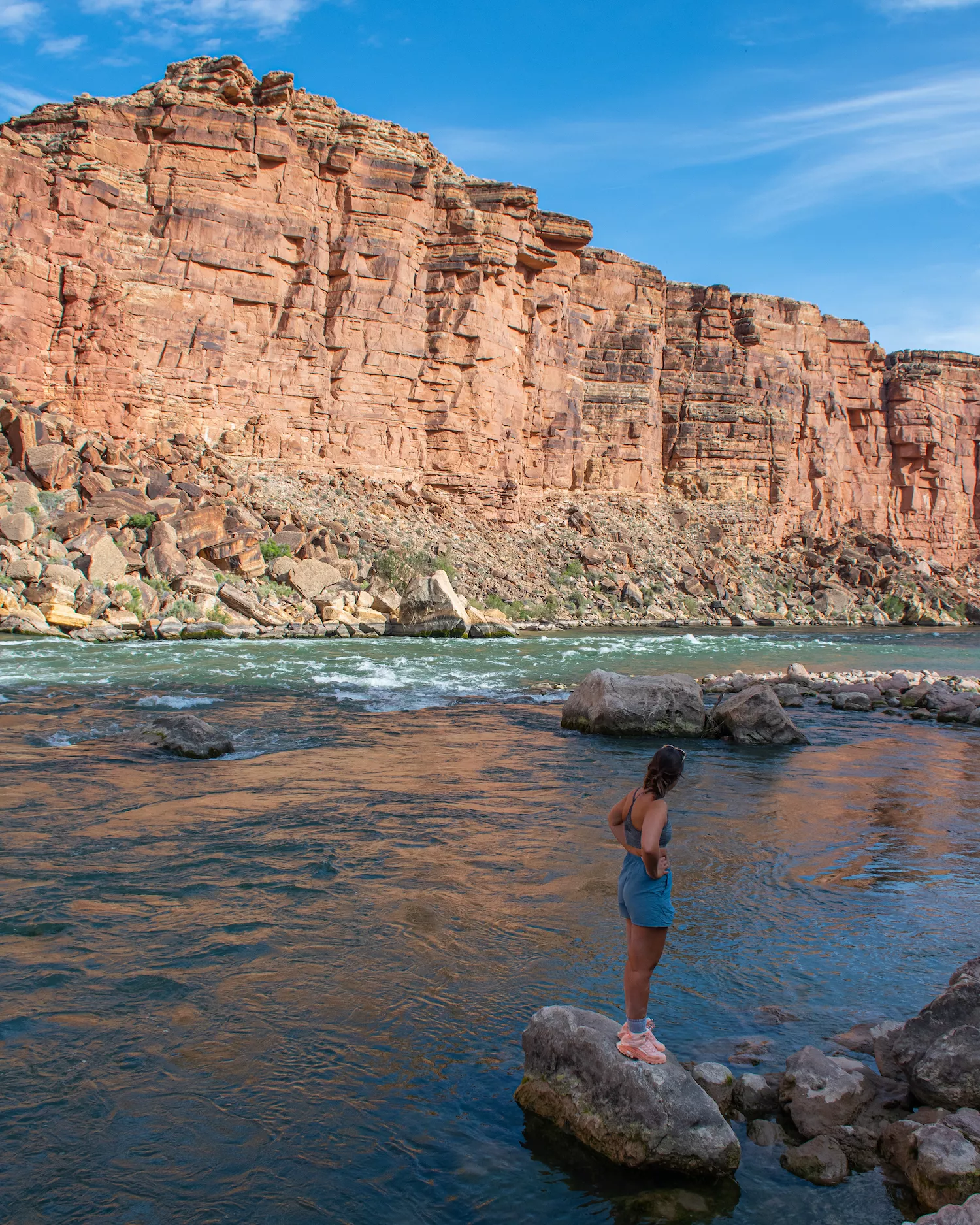 girl staring out at Colorado River on the Cathedral Wash trail