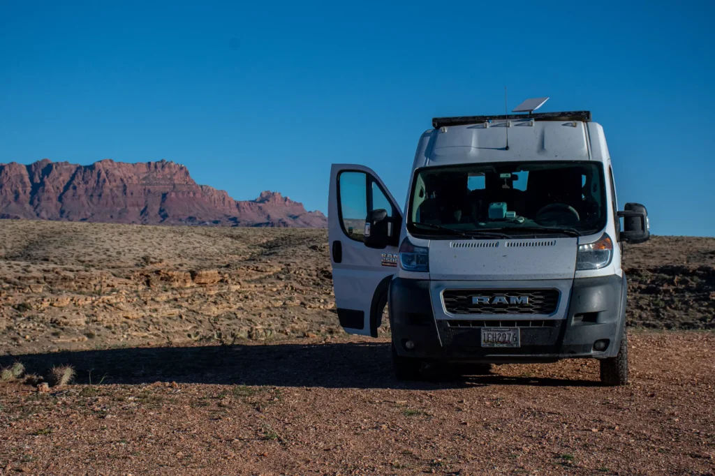 Van next to a large rock formation