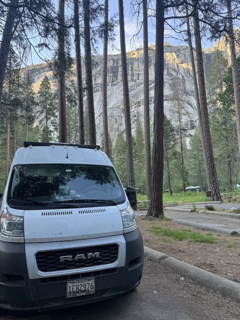 van in woods at North Pines campground