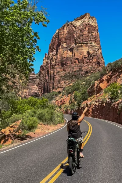 girl biking through Zion in May