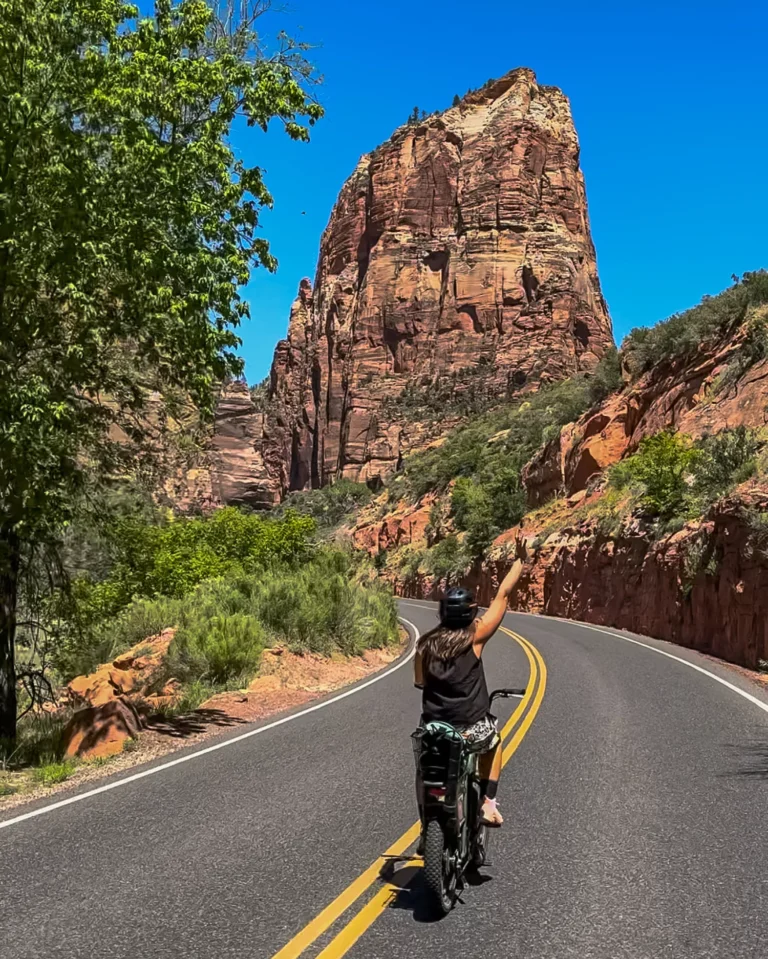 girl biking through Zion in May