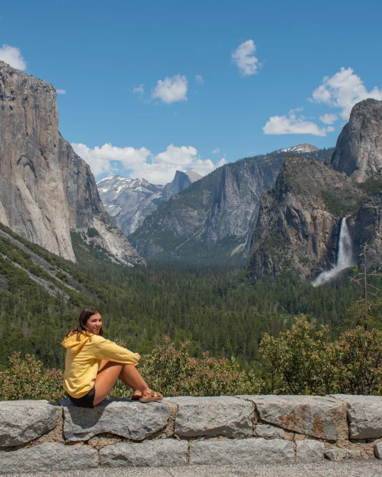 girl sitting at the tunnel view in Yosemite
