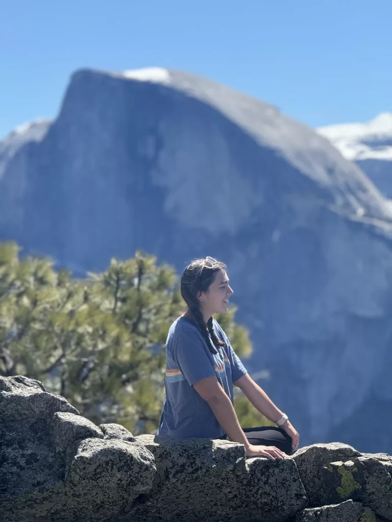 girl looking out from Half Dome