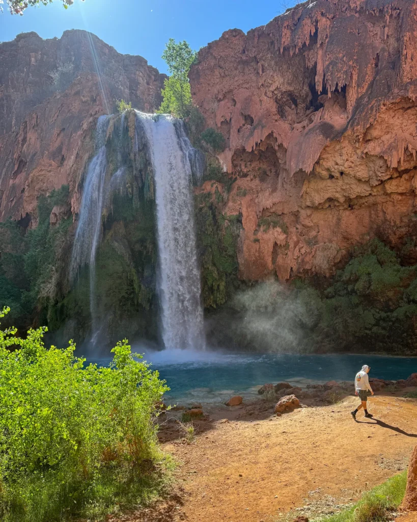 guy walking by havasu falls