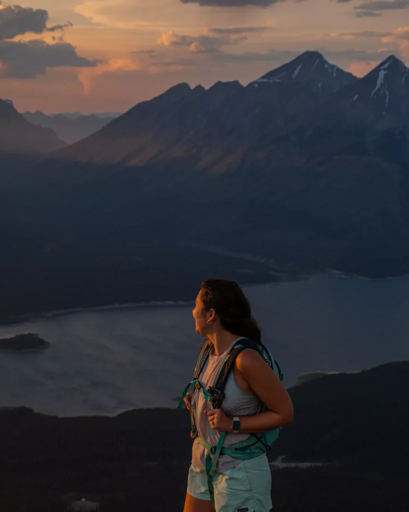 girl smiling out over tent ridge