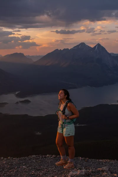 girl smiling at sunset on tent ridge horseshoe trail