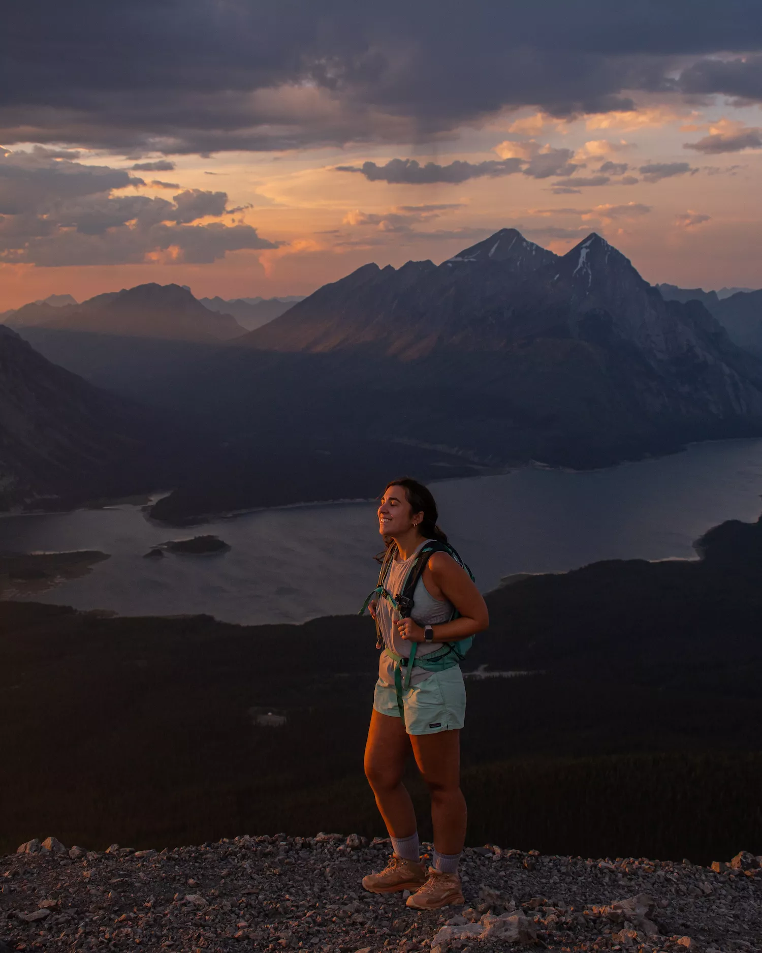 girl smiling at sunset on tent ridge horseshoe trail