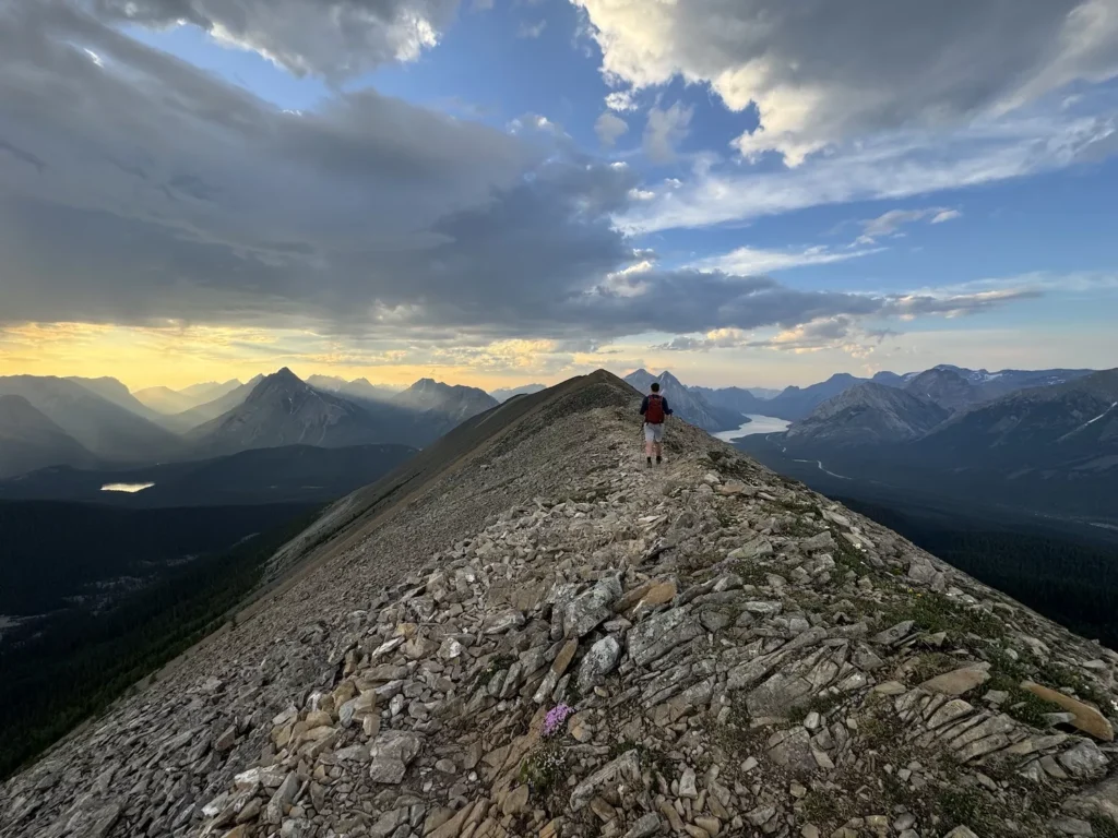 guy walking on ridge line