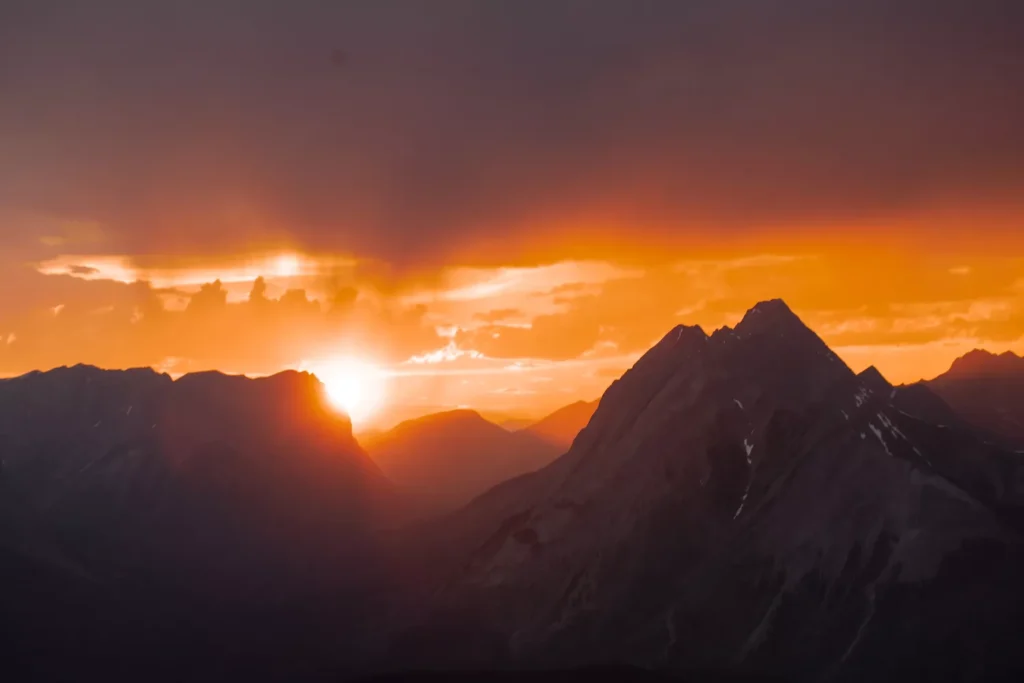 sun setting over mountains