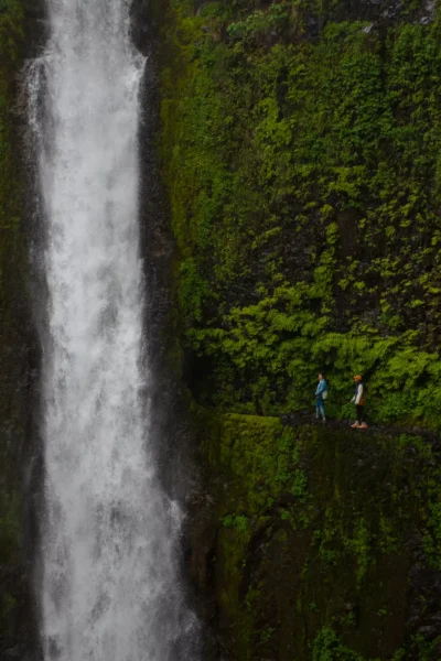 two people at Eagle Creek by tunnel falls