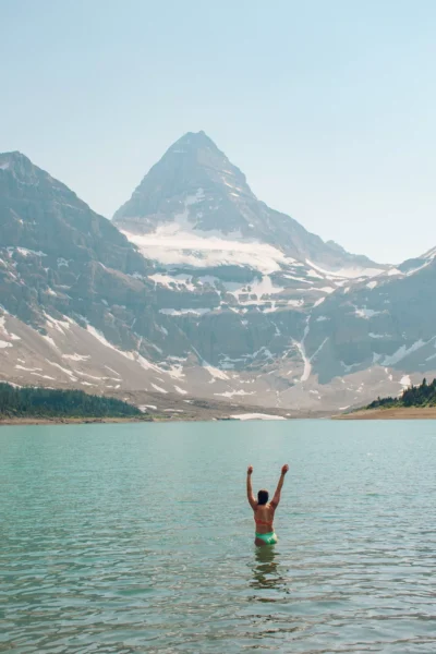 girl throwing up water in front of Mt Assiniboine