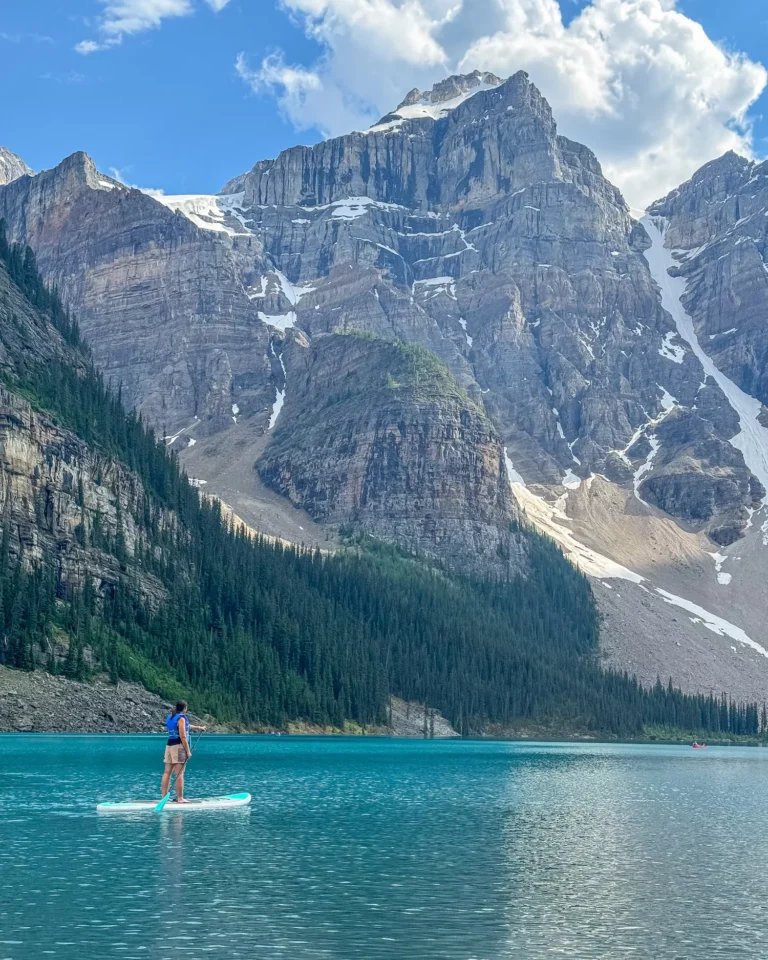 girl paddling on moraine lake