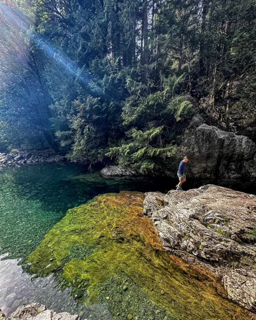 guy walking with gorgeous pools right there