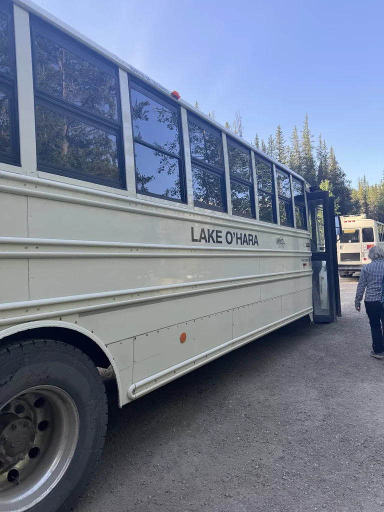 old school bus with lake o'hara on the side