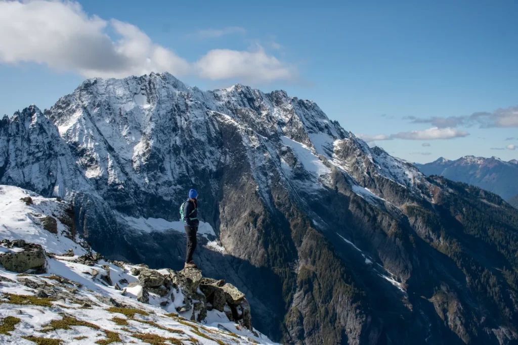 woman standing on mountain top