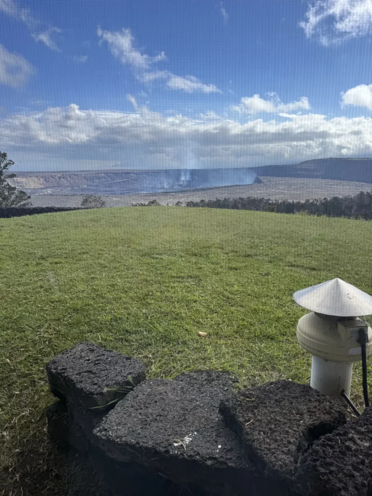 Volcano house window looking out at steaming crater
