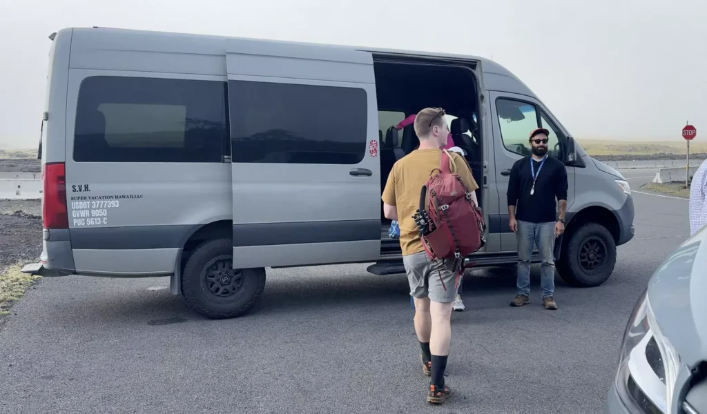 a 4wd van with a guy walking into it