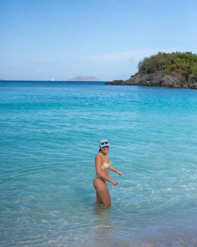 Girl standing in vibrant blue water in Virgin Islands