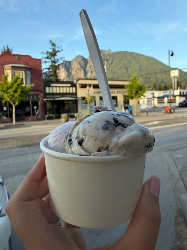 holding an ice cream cup below Mt Si