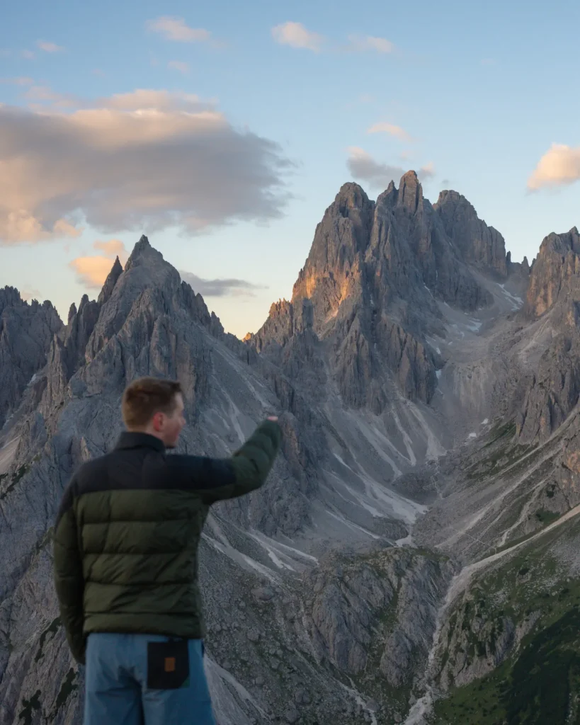 guy pointing to cadini di misurina