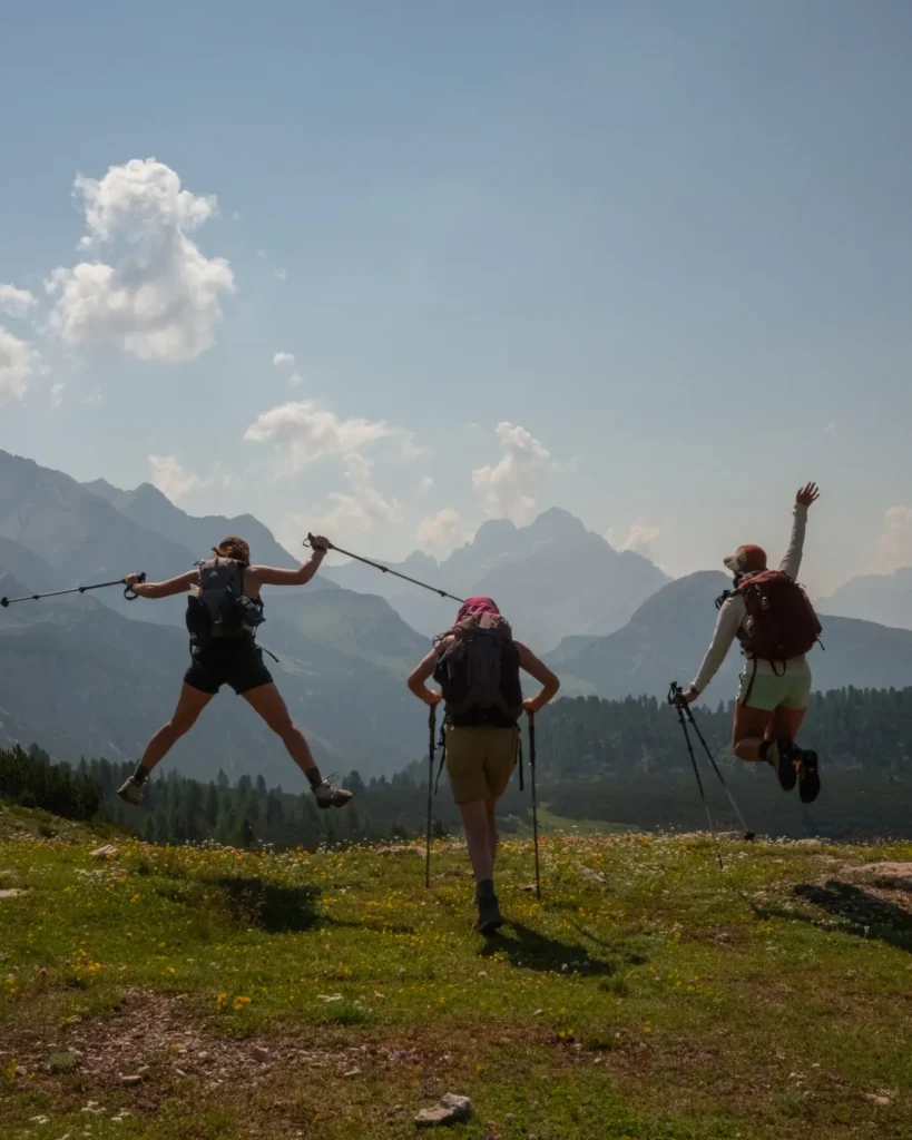 three girls jumping for joy on the Alta Via 1