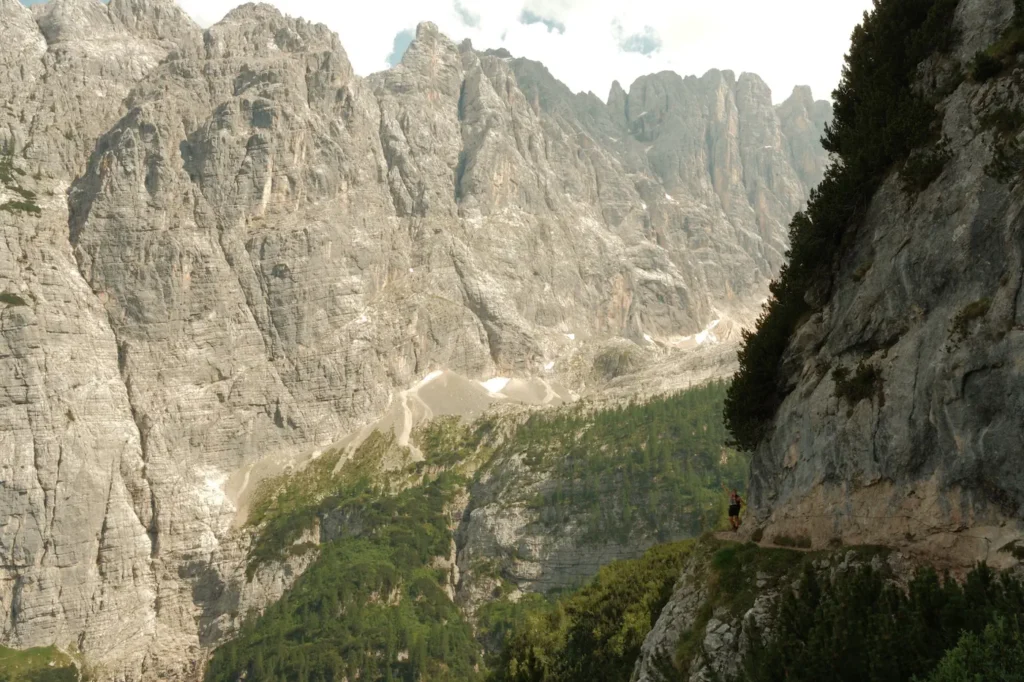 gal on the edge of mountain in Dolomites