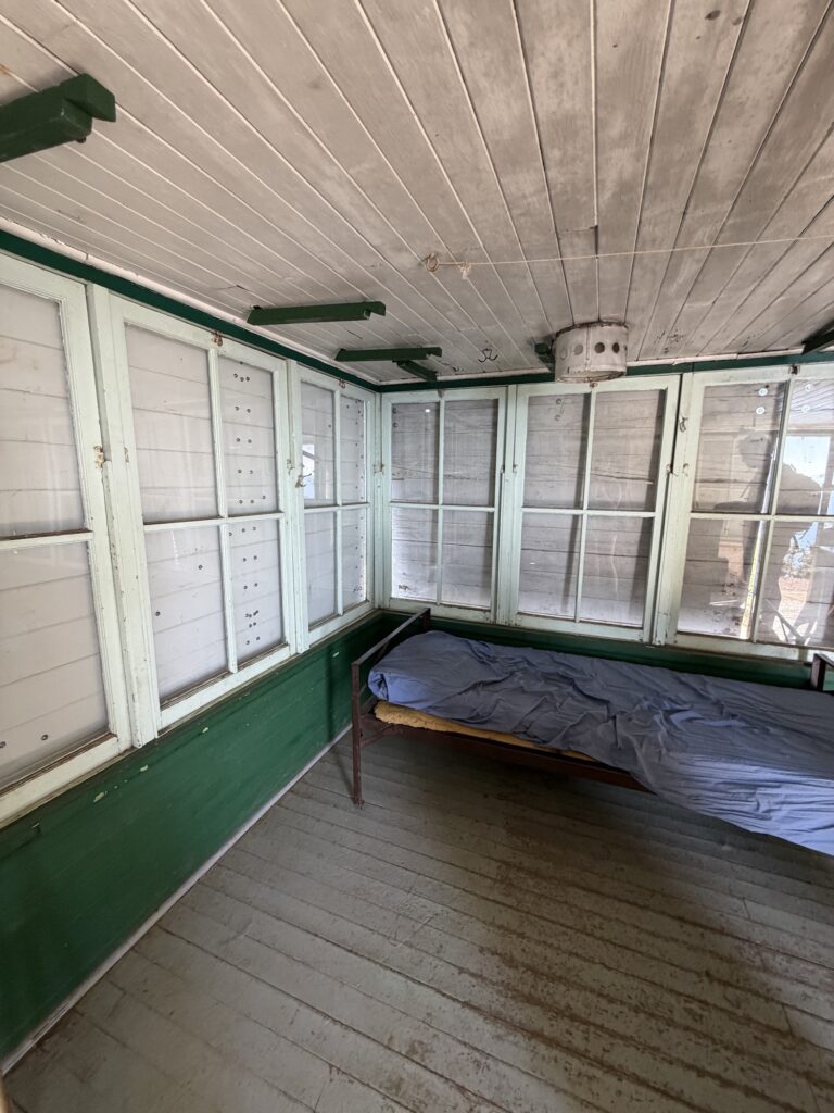 bed sitting in the fire lookout, a simple cot